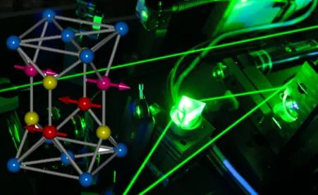 Schematics and an antiferromagnetic crystal on a background with laser beams.